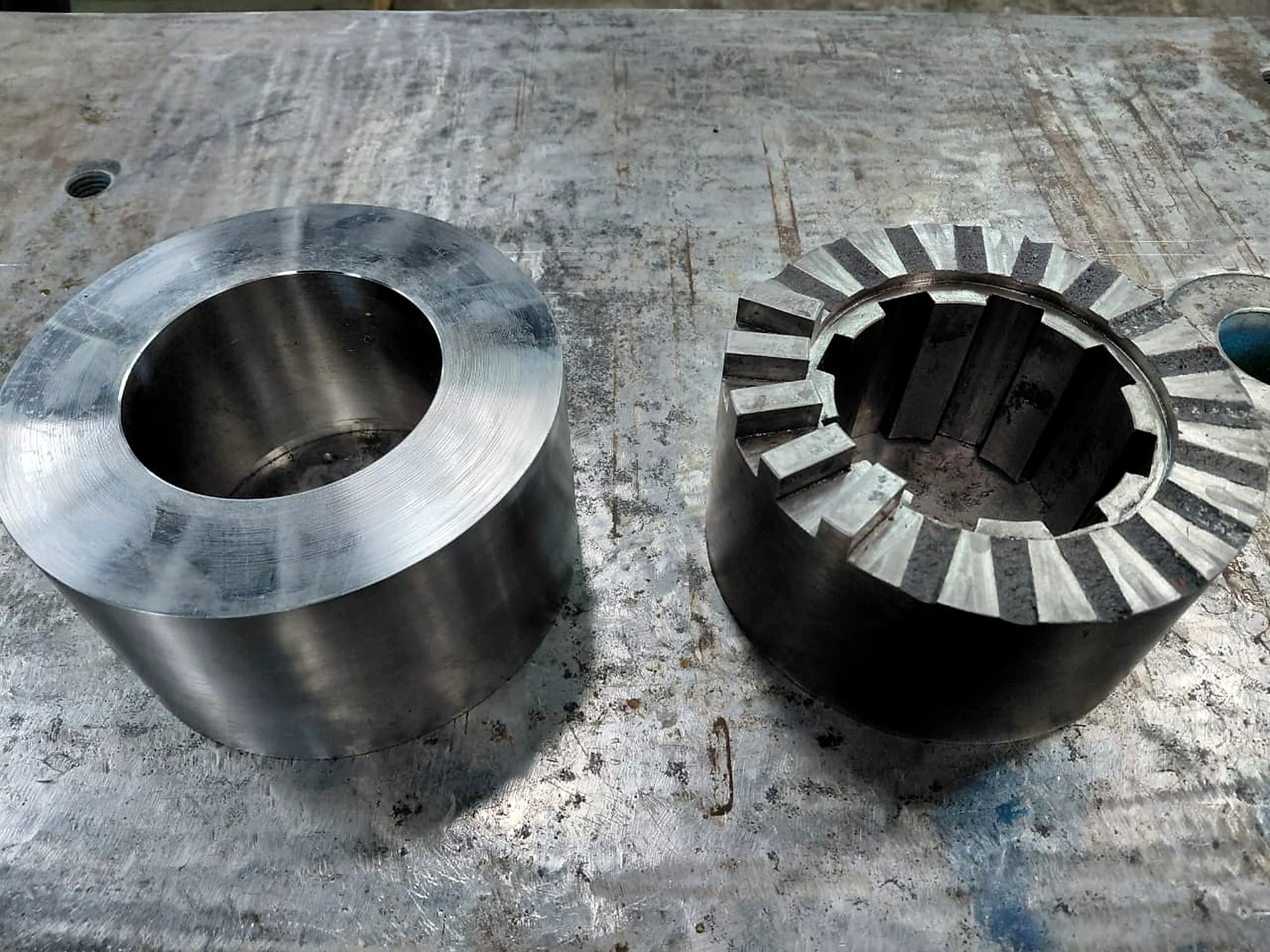Precision-machined steel components on a workbench