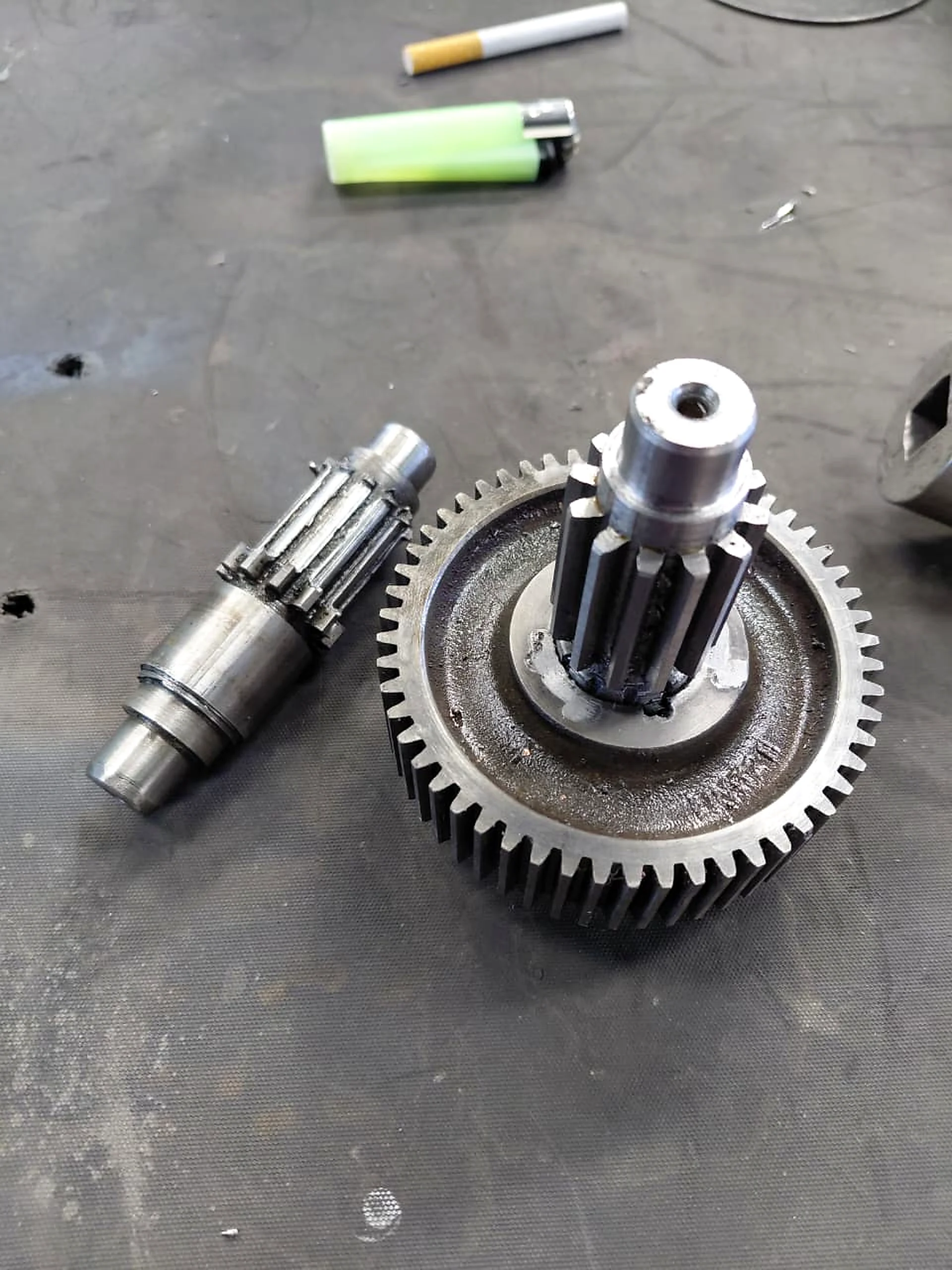 Precision gear and shaft components on an engineering workbench